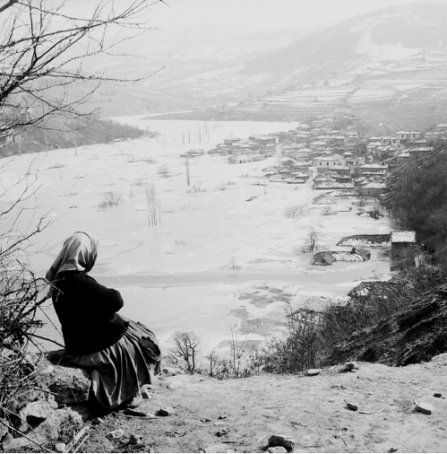 Woman looking at her flooded village of Zavoj in 1963. Photo: Božidar Manić – Žoli, Historical Archive of Pirot